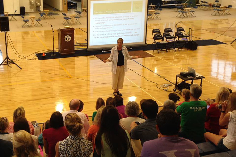 Jennifer talking to students in gymnasium