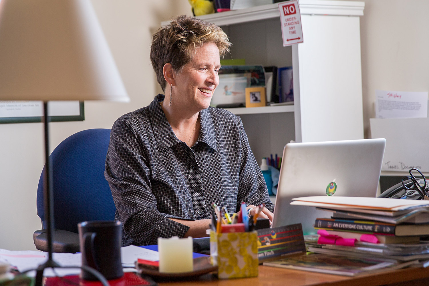 Jennifer working at her desk